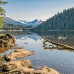 The mountains and trees reflect in Auke Lake on May 25, 2019. (Courtesy Photo | Kerry Howard)