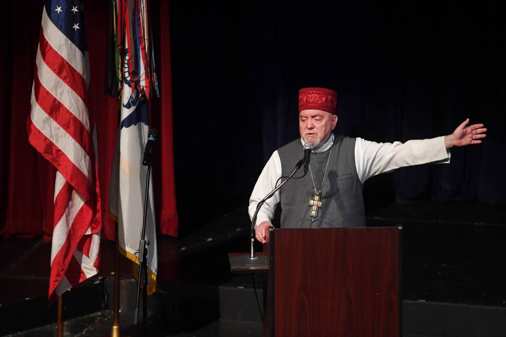 Father Michael Oleksa, an Elder of the Alaska Federation of Natives, offers an inspirational story during a memorial for the Guardian Flight crew at Juneau-Douglas High School: Yadaa.at Kalé on Friday, June 7, 2019. (Michael Penn | Juneau Empire)