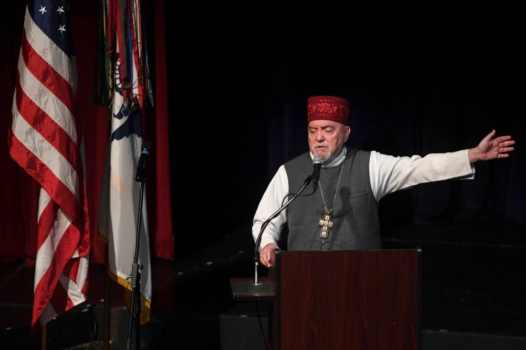Father Michael Oleksa speaks during the memorial service for the Guardian Flight crew held at Juneau-Douglas High School: Yadaa.at Kalé on Friday, June 7, 2019. (Michael Penn | Juneau Empire)