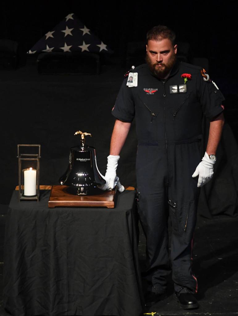 A Bell Ceremony is performed during the memorial service for the Guardian Flight crew held at Juneau-Douglas High School: Yadaa.at Kalé on Friday, June 7, 2019. (Michael Penn | Juneau Empire)