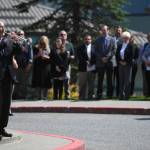 Rick Trostel plays taps at the end of the memorial service for the Guardian Flight crew held at Juneau-Douglas High School: Yadaa.at Kalé on Friday, June 7, 2019. (Michael Penn | Juneau Empire)