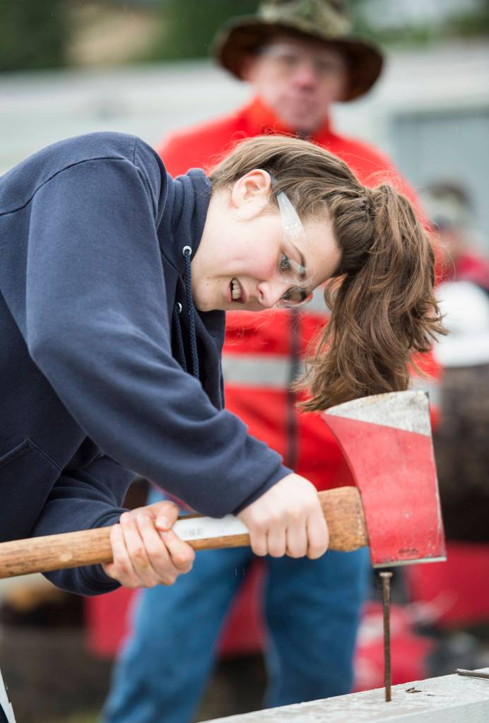 Abigail Hoy competes in the womens spike driving contest during the 27th annual Juneau Gold Rush Days at Savikko Park. (Michael Penn | Juneau Empire File)