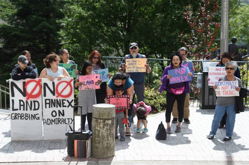 People with connections to Admiralty Island hold a protest against the City and Borough of Juneaus annexation of parts of Admiralty Island in front of the Capitol on Friday, June 14, 2019. (Michael Penn | Juneau Empire)