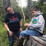 Auntie Vivian Mork Yéilk and nephew Jackson Pearson work on devils club. (Vivian Faith Prescott | For the Capital City Weekly)