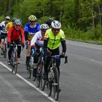 John Bursell, front, and Jamie Bursell, in white, lead a pack of riders in the Kluane Chilkat International Bike Relay on the Haines Highway between Haines Junction, Yukon, and Haines on Saturday, June 15, 2019. Jamie and John Bursell finished just five seconds apart from one another in the solo division, completing the 148-mile race in under 11 hours. (Courtesy Photo | Rob Welton)