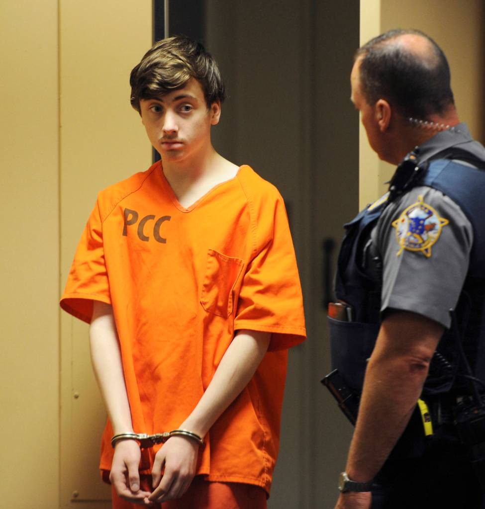 Kayden McIntosh, 16, appears in a Superior courtroom for his arraignment in the Nesbett Courthouse on Tuesday. Six people have been charged in the death of of Cynthia Hoffman including the gunman, McIntosh. Hoffman was taken to the Thunderbird Falls trailhead in Chugiak where she was bound with duct tape, shot and left in the Eklutna River on June 2, according to charges. (Bill Roth/Anchorage Daily News via AP)