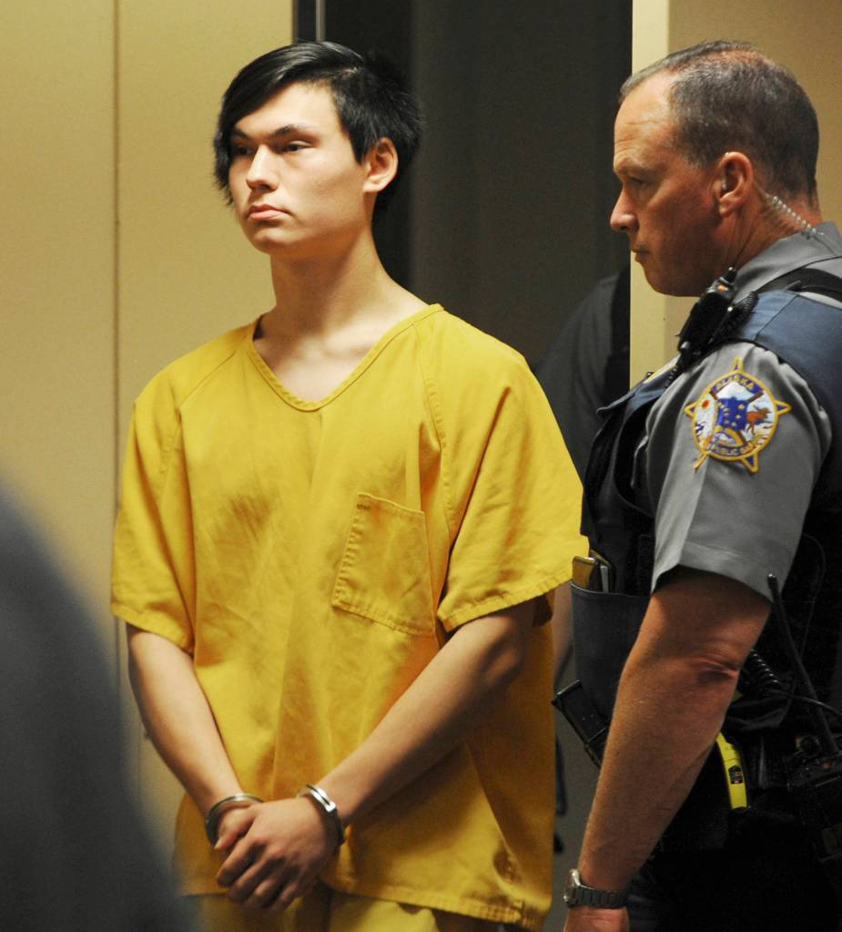 Caleb Leyland, 19, appears in a Superior courtroom for his arraignment in the Nesbett Courthouse on Tuesday in Anchorage. Six people have been charged n the slaying of Cynthia Hoffman including Leyland. Hoffman was taken to the Thunderbird Falls trailhead in Chugiak where she was bound with duct tape, shot and left in the Eklutna River on June 2, according to charges. (Bill Roth/Anchorage Daily News via AP)