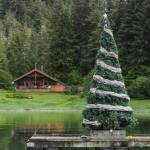 A Christmas tree decorates an anchored platform at Amalga Harbor on Wednesday, June 19, 2019. (Michael Penn | Juneau Empire)