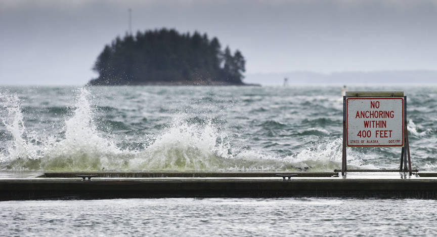 High winds send waves crashing into the breakwater at the Don Statter Memorial Boat Harbor in Auke Bay on Tuesday. (Michael Penn | Juneau Empire File)