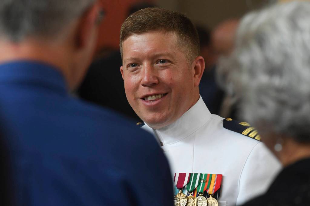 U.S. Coast Guard Commander Andrew S. Joca, right, speaks with guests after a Change of Command ceremony at the Juneau Arts and Culture Center on Thursday, June 20, 2019. Outgoing Commander Joca assumed command of the Civil Engineering Unit in Juneau in May 2016 and will become the Director of Operational Logistics in Norfolk, Virginia. (Michael Penn | Juneau Empire)