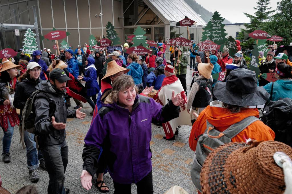 Rep. Sara Hannan, D-Juneau, dances with other advocates in front of the Alaska State Capitol to show local support for the 2001 National Roadless Rule during a Tongass Rally on Saturday, June 22, 2019. (Michael Penn | Juneau Empire)
