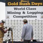 Jesse Stringer, left, explains the jackleg drill to fellow contestant Jesse Ross in the Mining & Logging Competition at the 29th Annual Gold Rush Days at Savikko Park on Saturday, June 22, 2019. (Michael Penn | Juneau Empire)
