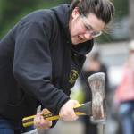 Abigail Hoy competes in the spike driving contest during the Mining & Logging Competition at the 29th Annual Gold Rush Days at Savikko Park on Saturday, June 22, 2019. (Michael Penn | Juneau Empire)
