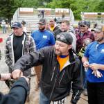 Heath Coro steps up to pick a number before the jackleg drill contest during the Mining & Logging Competition at the 29th Annual Gold Rush Days at Savikko Park on Saturday, June 22, 2019. (Michael Penn | Juneau Empire)