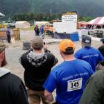 Contestants watch Brad Staley in the jackleg drilling contest during the Mining & Logging Competition at the 29th Annual Gold Rush Days at Savikko Park on Saturday, June 22, 2019. (Michael Penn | Juneau Empire)
