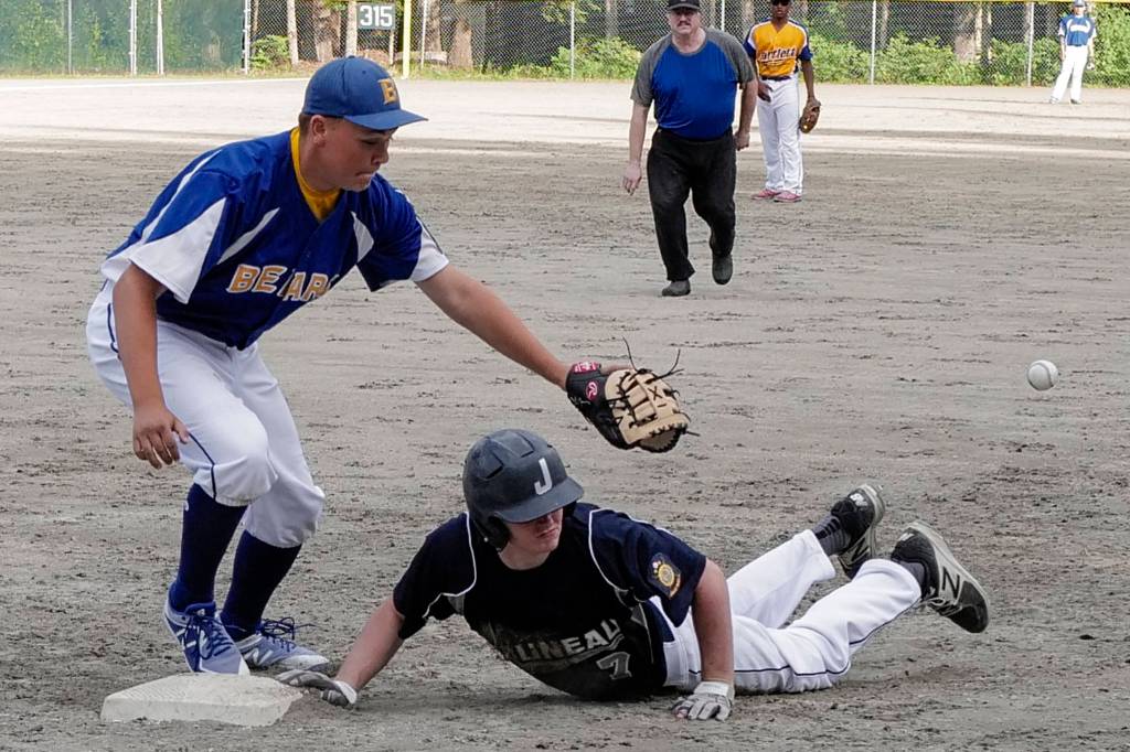 Juneaus Brock McCormick dives safely back to first base as the ball gets by Bartletts Taylor McCartin the fourth inning in Legion League baseball at Adair-Kennedy Memorial Park on Friday, June 21, 2019. (Michael Penn | Juneau Empire)