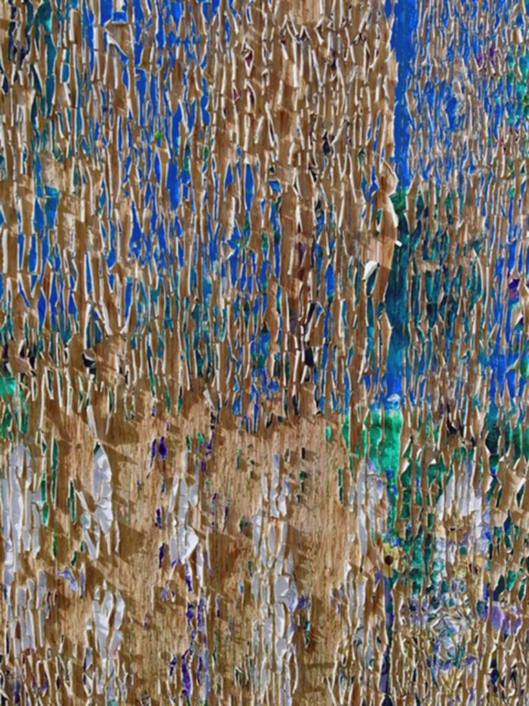 Courtesy photos | <strong>Denise Carroll</strong>                                <strong>Above: </strong>Sun-dried curling paint forms a colorful abstract pattern on a garage wall in Tok on June 7.                                 <strong>Top Right:</strong> A decorative metal bird-like windsock blows in the wind in Gas Works Park, Seattle on June 16.                                 <strong>Right</strong>: Mini cairns decorate a piece of driftwood at Outer Point on June 23.                                The Capital City Weekly welcomes reader-submitted photos of art in unusual or unexpected places. To submit, email your photos and captions to editor@capweek.com