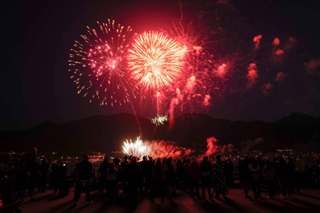 Juneau residents gather around the downtown waterfront to watch the annual fireworks display on Wednesday, July 3, 2019. (Michael Penn | Juneau Empire)