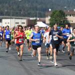 Glenn Frick Memorial Mile participants cruise down Egan Highway in the first half-mile of the race on Thursday, July 4, 2019. (Michael Penn | Juneau Empire)