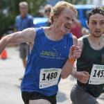 Joshua Musson, left, Dylan Anthony sprint to the finish In the Glenn Frick Race for second place on Thursday, July 4, 2019. (Michael Penn | Juneau Empire)