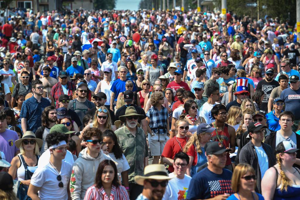 People parade to Savikko Park at the end of the Douglas Fourth of July Parade on Thursday, July 4, 2019. (Michael Penn | Juneau Empire)