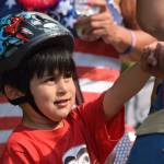 Kaash Katasse, 5, shakes hands with a race official after receiving his participation medal during the Soapbox Challenge during the Douglas Fourth of July festivities on Thursday, July 4, 2019. (Nolin Ainsworth | Juneau Empire)