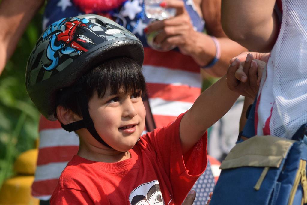 Kaash Katasse, 5, shakes hands with a race official after receiving his participation medal during the Soapbox Challenge during the Douglas Fourth of July festivities on Thursday, July 4, 2019. (Nolin Ainsworth | Juneau Empire)