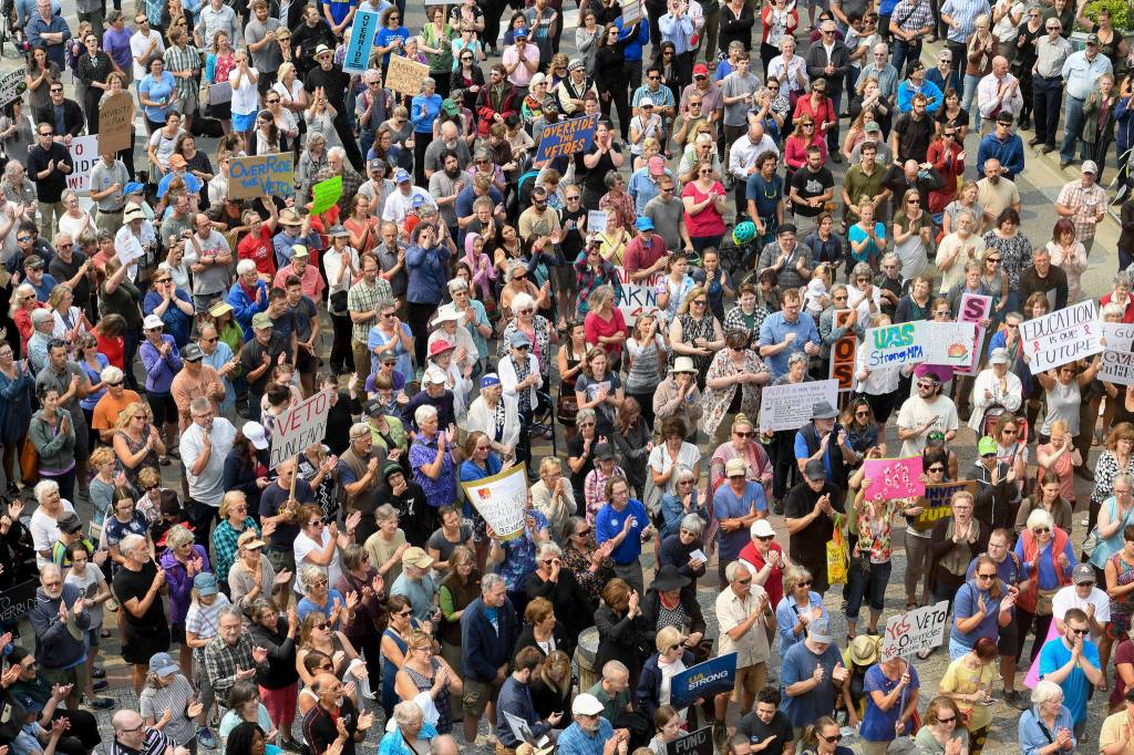 Hundreds attend a rally in front of the Capitol calling for an override of Gov. Mike Dunleavys budget vetoes on the first day of the Second Special Session of the Alaska Legislature in Juneau on Monday, July 8, 2019. (Michael Penn | Juneau Empire)