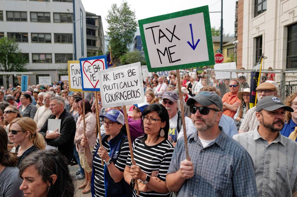 Hundreds attend a rally in front of the Capitol calling for an override of Gov. Mike Dunleavys budget vetoes on the first day of the Second Special Session of the Alaska Legislature in Juneau on Monday, July 8, 2019. (Michael Penn | Juneau Empire)