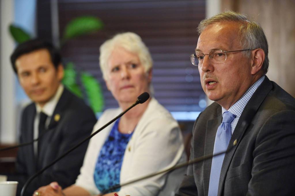 Speaker of the House Rep. Bryce Edgmon, I-Dillingham, speaks to the media as Rep. Louise Stutes, R-Kodak, and Rep. Neal Foster, D-Nome, listen after a failed override vote on Gov. Mike Dunleavys budget vetoes during a Joint Session of the Alaska Legislature at the Capitol on Wednesday, July 10, 2019. (Michael Penn | Juneau Empire)