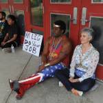 Protesters wore chains as they blocked doors at Wasilla Middle School before the legislative special session on Wednesday, July 10, 2019. (Bill Roth / ADN)