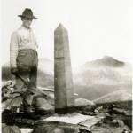 A man working with the International Boundary Commission in the early 1900s poses next to one of more than 200 obelisks that line the Alaska/Canada border. (Courtesy photo | NOAA Photo Library)