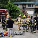 Firefighters on scene at Foster Avenue. (Michael Penn | Juneau Empire)