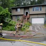 Capital City Fire/Rescue responds to a house fire at 2999 Foster Avenue on Thursday, July 11, 2019. (Michael Penn| Juneau Empire)