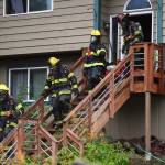 Capital City Fire/Rescue responds to a house fire at 2999 Foster Avenue on Thursday, July 11, 2019. (Michael Penn| Juneau Empire)