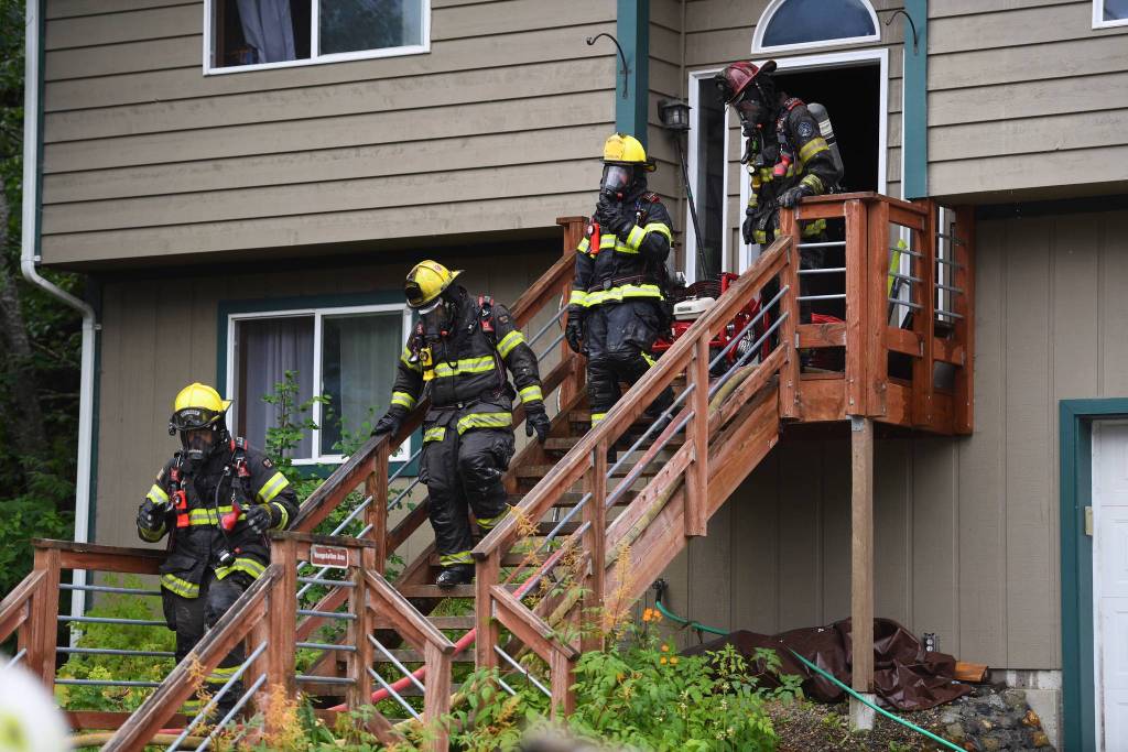 Capital City Fire/Rescue responds to a house fire at 2999 Foster Avenue on Thursday, July 11, 2019. (Michael Penn| Juneau Empire)