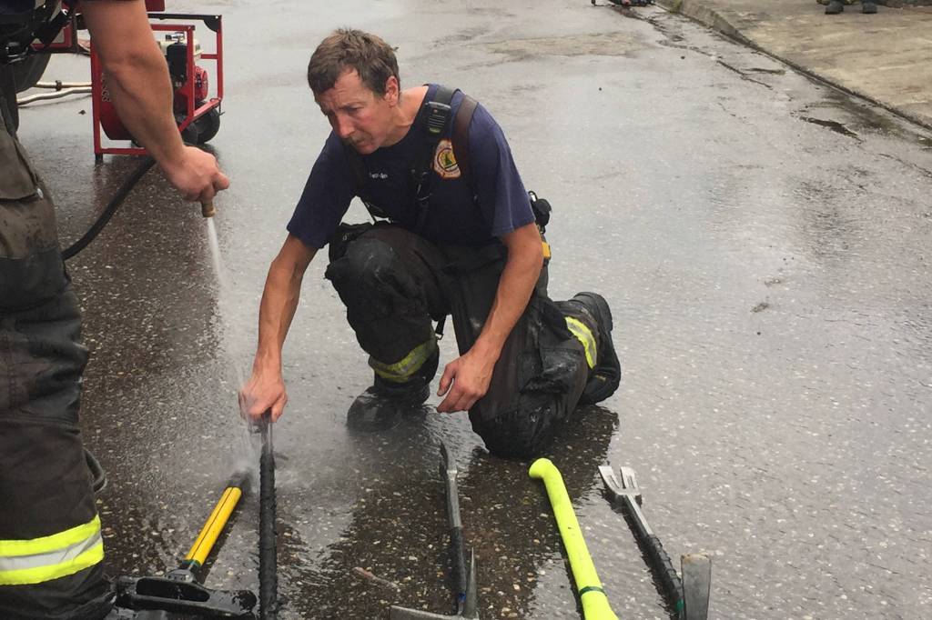 Firefighter saves pitbull in Douglas house fire