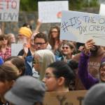 Over hundred people march from the Capitol to the Governors Mansion during a rally to protest budget vetoes by Gov. Mike Dunleavy on Friday, July 12, 2019. (Michael Penn | Juneau Empire)
