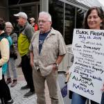 Over hundred people march from the Capitol to the Governors Mansion during a rally to protest budget vetoes by Gov. Mike Dunleavy on Friday, July 12, 2019. (Michael Penn | Juneau Empire)