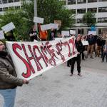 Over hundred people march from the Capitol to the Governors Mansion during a rally to protest budget vetoes by Gov. Mike Dunleavy on Friday, July 12, 2019. (Michael Penn | Juneau Empire)