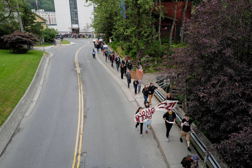 Over hundred people march from the Capitol to the Governors Mansion during a rally to protest budget vetoes by Gov. Mike Dunleavy on Friday, July 12, 2019. (Michael Penn | Juneau Empire)
