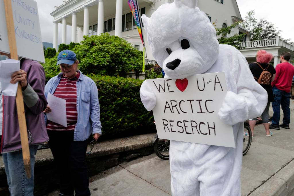 Over hundred people march from the Capitol to the Governors Mansion during a rally to protest budget vetoes by Gov. Mike Dunleavy on Friday, July 12, 2019. (Michael Penn | Juneau Empire)