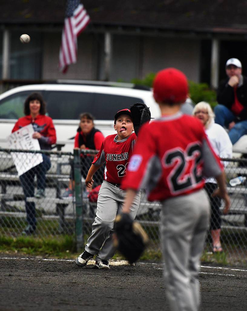 Juneau first baseman Drew Cadigan-McAdoo reaches for a catch in the Alaska District 2 Little League Special Games tournament between Ketchikan Little League and Gastineau Channel Little League at Norman Walker Field in Ketchikan on Thursday, July 11, 2019. (Dustin Safranek | Ketchikan Daily News)