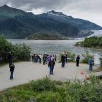 Visitors at Mendenhall Lake on Monday, July 15, 2019. A glacial lake outburst flood from Suicide Basin released into Mendenhall Lake last week and peaked Sunday night. (Michael Penn | Juneau Empire)