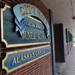 A pedestrian walks by City Hall on June 7, 2017. (Alex McCarthy | Juneau Empire File)