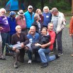 Former staff of the False Island Young Adult Conservation Corps pose for a picture during the groups reunion Friday, July 19, 2019, at the Eagle River United Methodist Camp in Juneau. The camps former director, Lisa Louie, is pictured in the front row. (Michael S. Lockett | Juneau Empire)