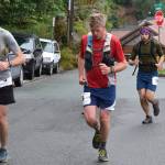 Franz Mueter, left and Alex Andrews lead a group of runners up Basin Road at the start of the Juneau Ridge Race on Saturday, July 20, 2019. Over 60 runners participated in the 15-mile mountain running race that featured approximately 5,000 feet of elevation gain. (Nolin Ainsworth | Juneau Empire)