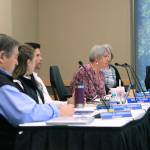 Regent Karen Perdue, center, speaks at an emergency meeting of the University of Alaska Board of Regents on Monday, July 22, 2019, in Anchorage, Alaska. Regents voted 10-1 to declare a financial exigency, allowing administrators to expedite layoffs of tenured faculty in the face of severe budget issues. (AP Photo/Dan Joling)