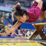 Coach Kaytlynne Lewis competes in the bench reach at the World-Eskimo Indian Olympics at the Carlson Center in Fairbanks on Saturday, July 20, 2019. (Greg Lincoln | For the Juneau Empire)