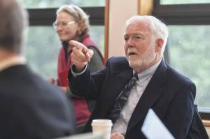 Dr. Richard Caulfield, Chancellor at the University of Alaska Southeast, watches an online meeting being held at UA campuses around the state on Gov. Mike Dunleavys budget cuts on Monday, July 15, 2019. (Michael Penn | Juneau Empire File)